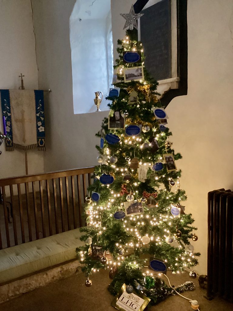 The Heritage Group Christmas Tree by the altar in All Saints Church Lubenham